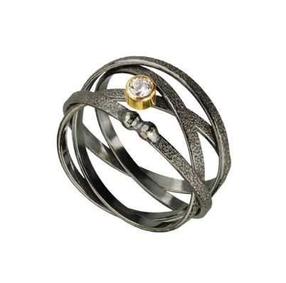 Orbit Wrap Ring
Oxidized silver, white topaz
Solid 18K bezel

RGOR01-M/TZ/OX  250.